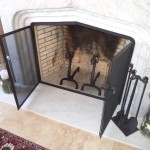 Fireplace with figural andirons, tools